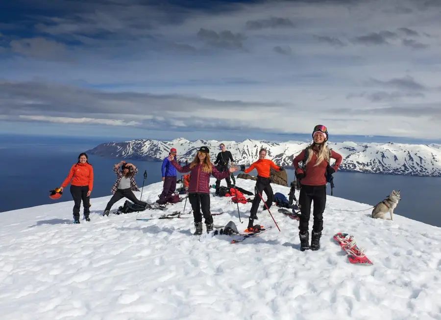 People on the top of the mountain during the winter.