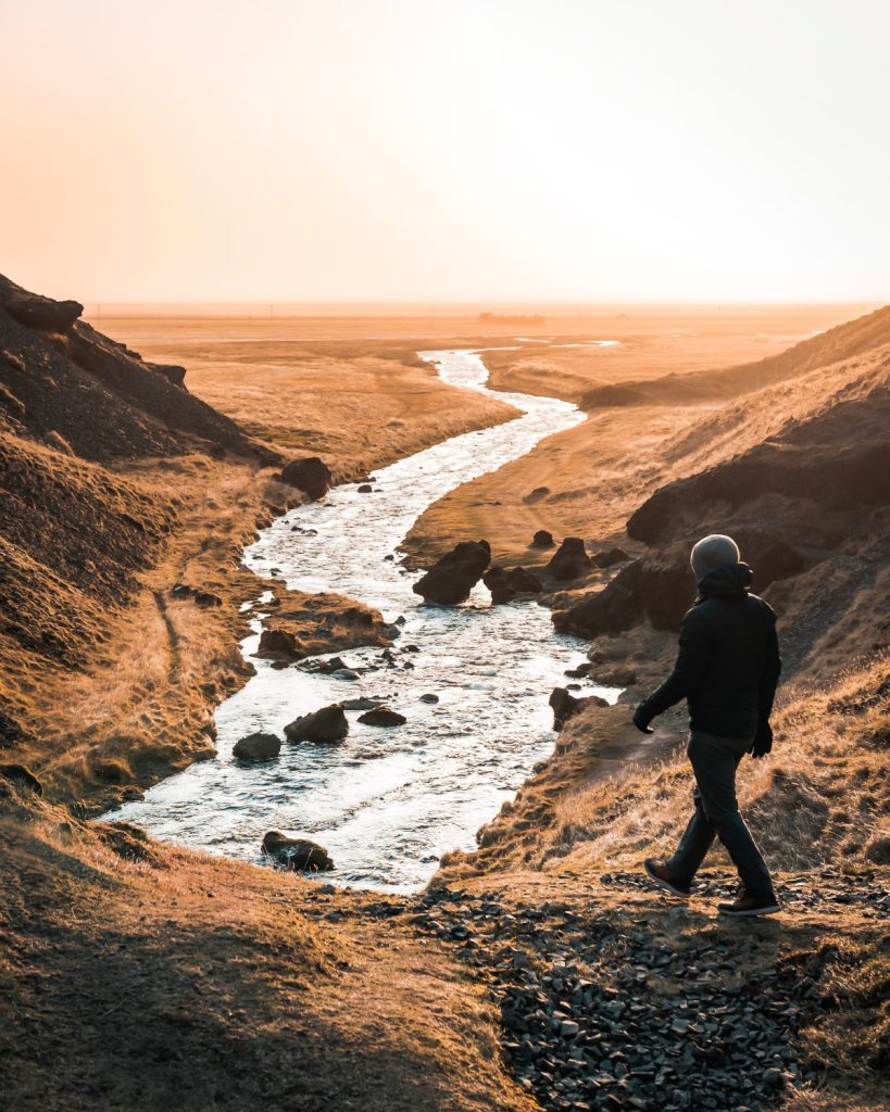 Man walking by river