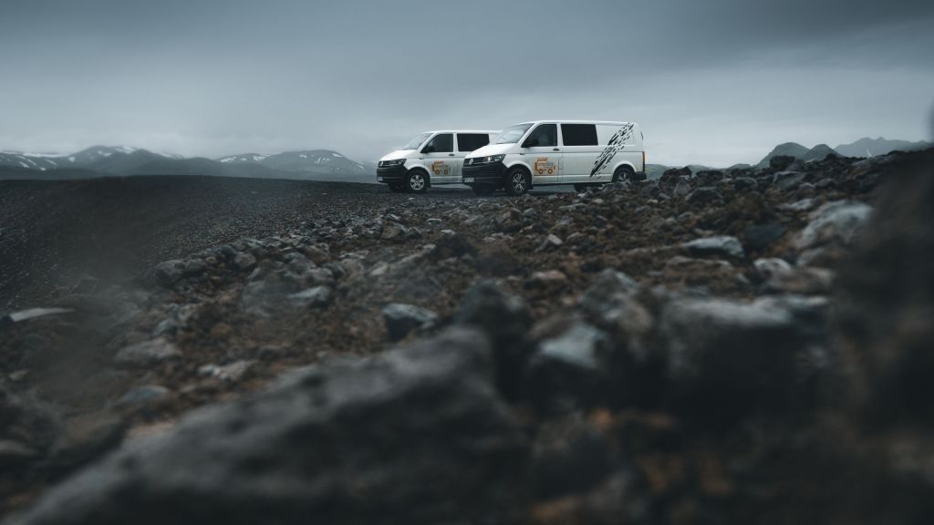 Two campervans in the field