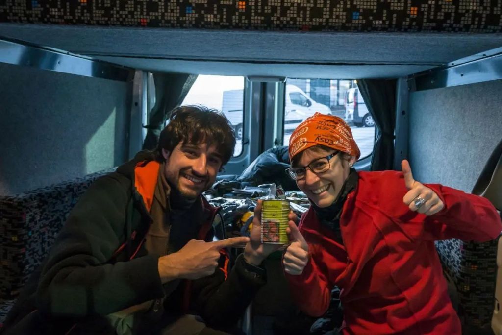 two people sitting in a camper