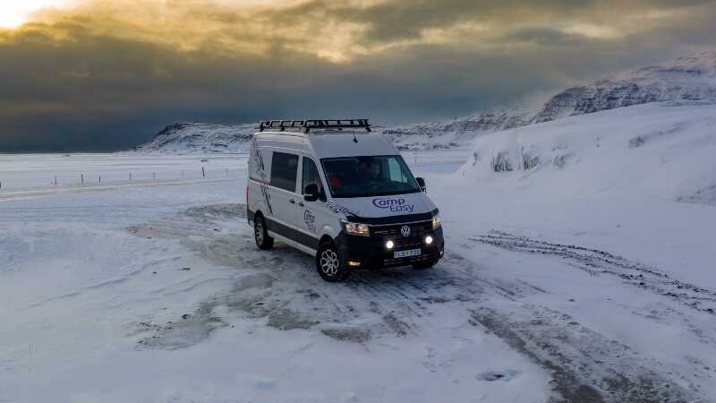 Campervan parked on the snow