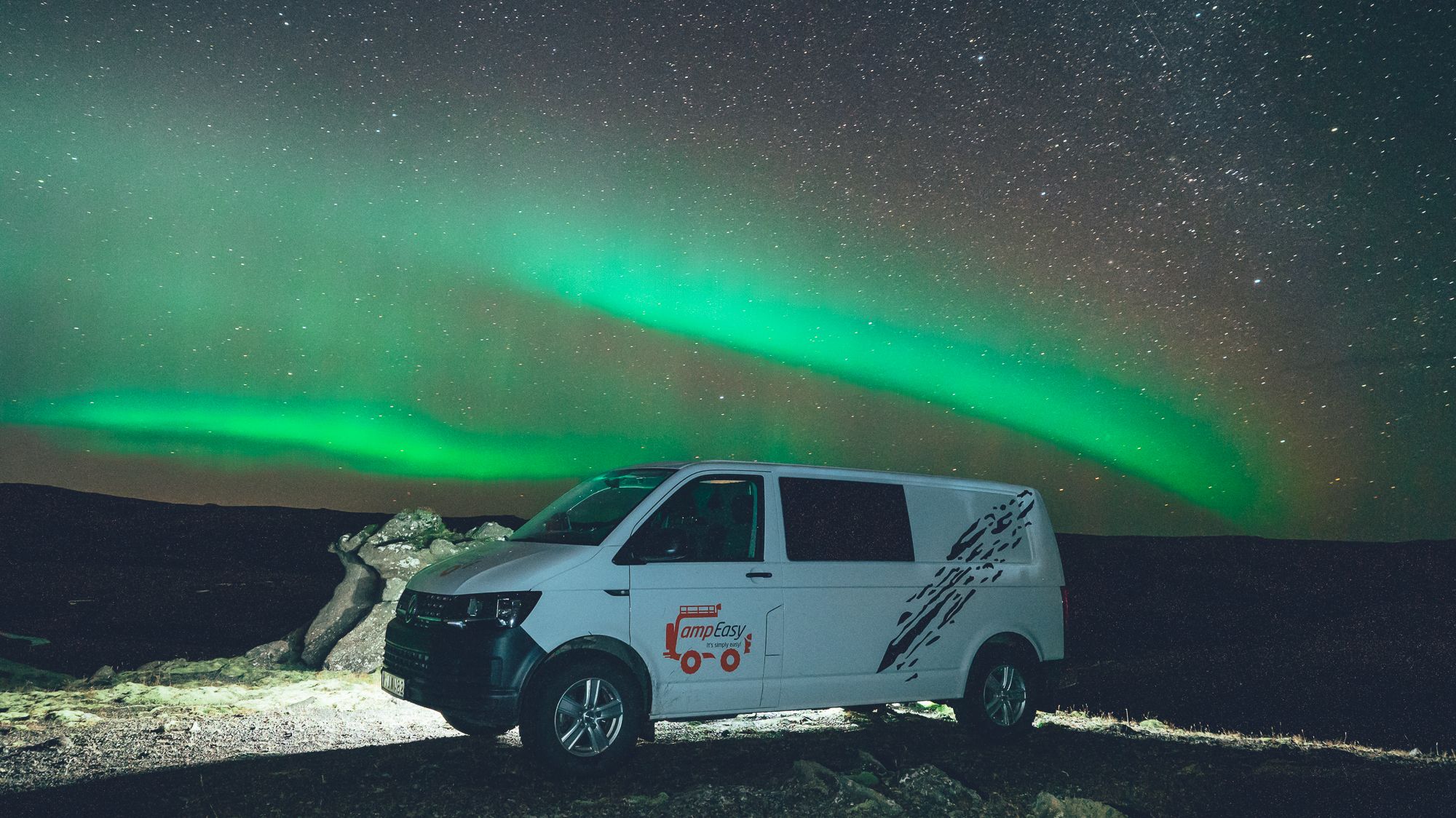 camper under auroa borealis