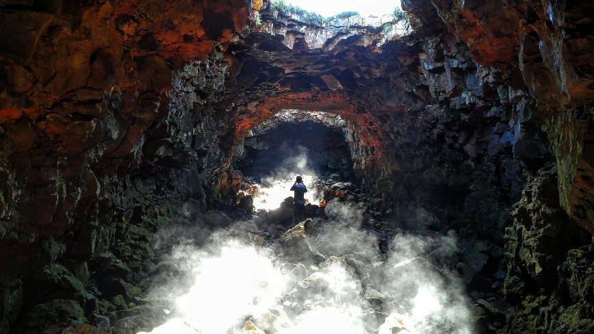 Person taking some pictures in lava tunnel