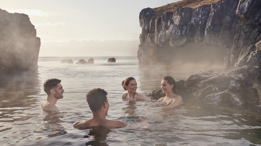4 people taking bath in geothermal lagoon