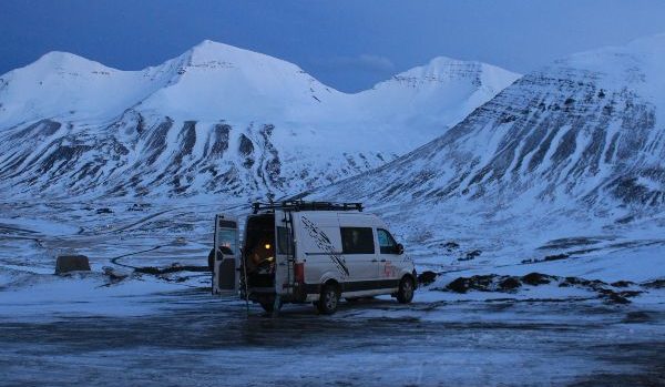 View on campervan surrounded by snowy scenery