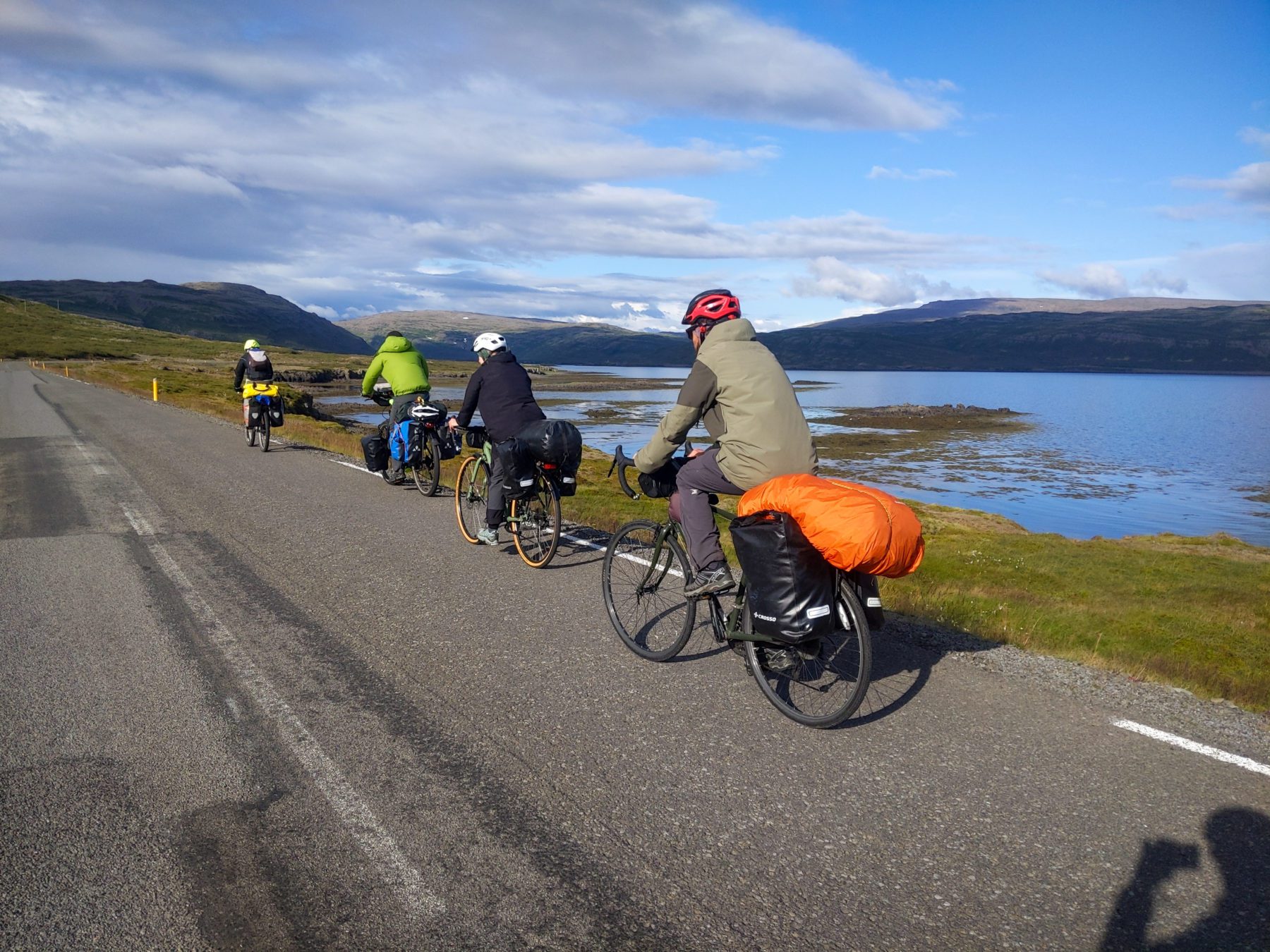 Group of bicyclists on the side of the road in Iceland.