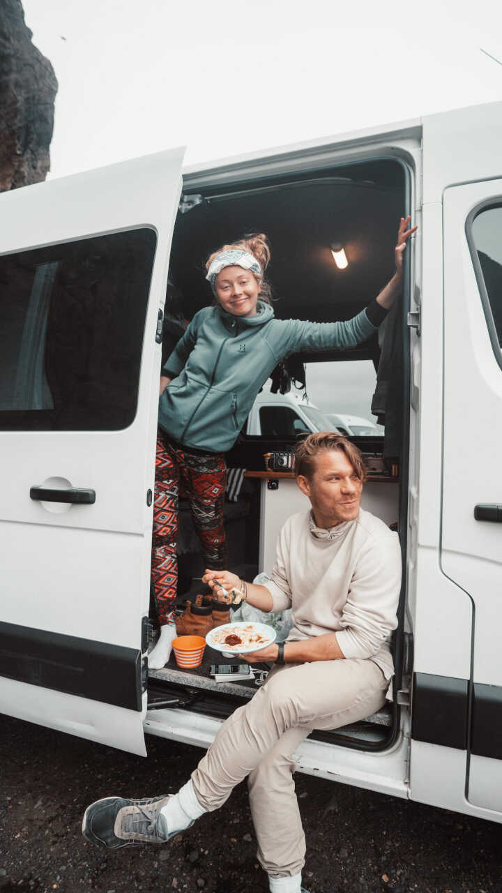 2 people inside a campervan