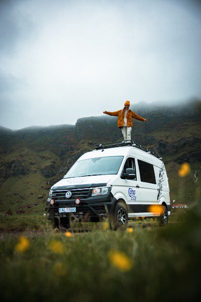 Woman on the campervans roof rack