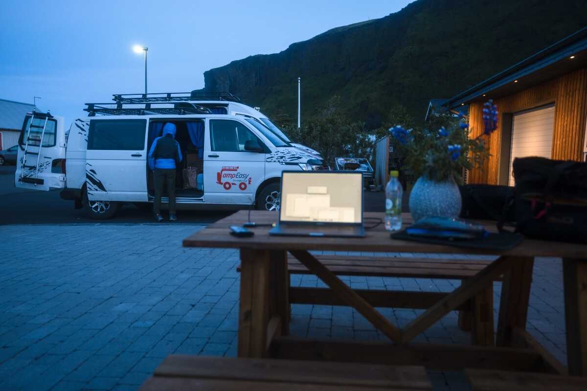 two camper vans parked on petrol station