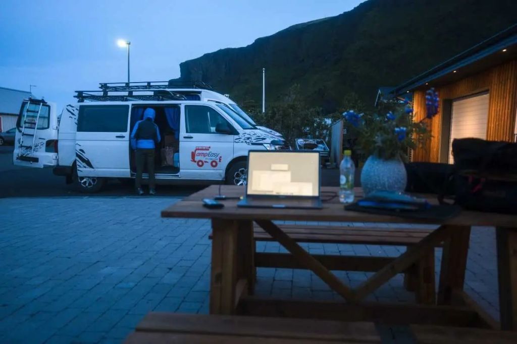 Campervan parked next to the buildings