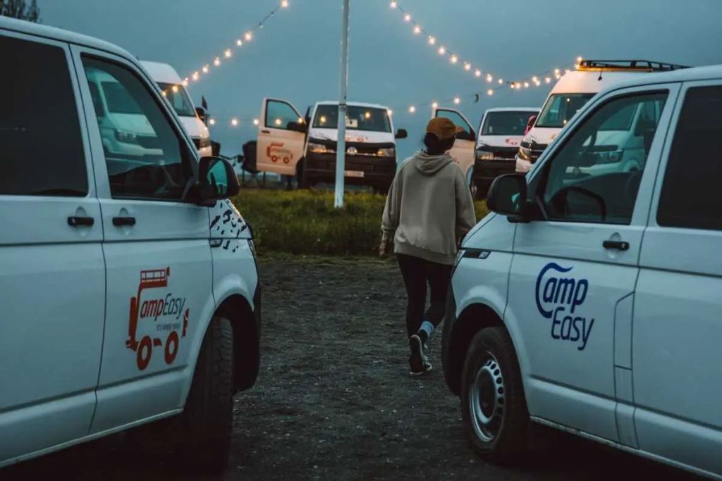 two campervans parked next to the each other