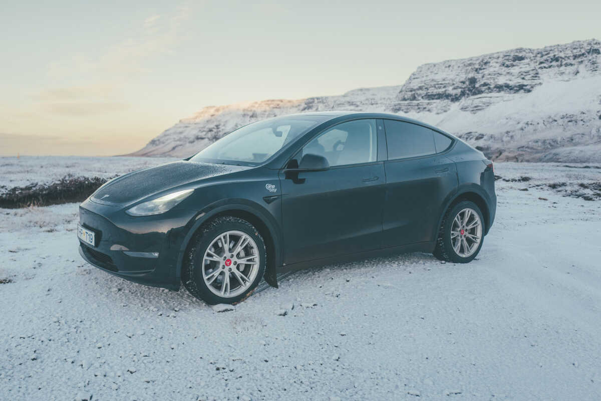 Tesla parked on the gravel