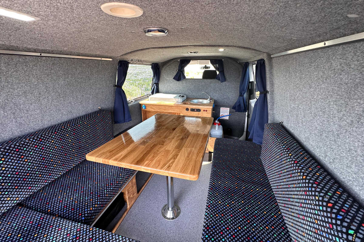 Interior view of the campervan focued od the dinning area
