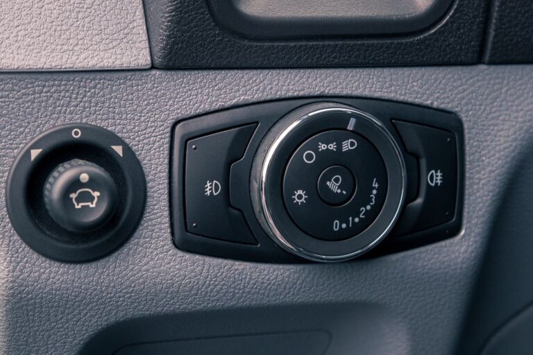 Close-up of car lights controls.
