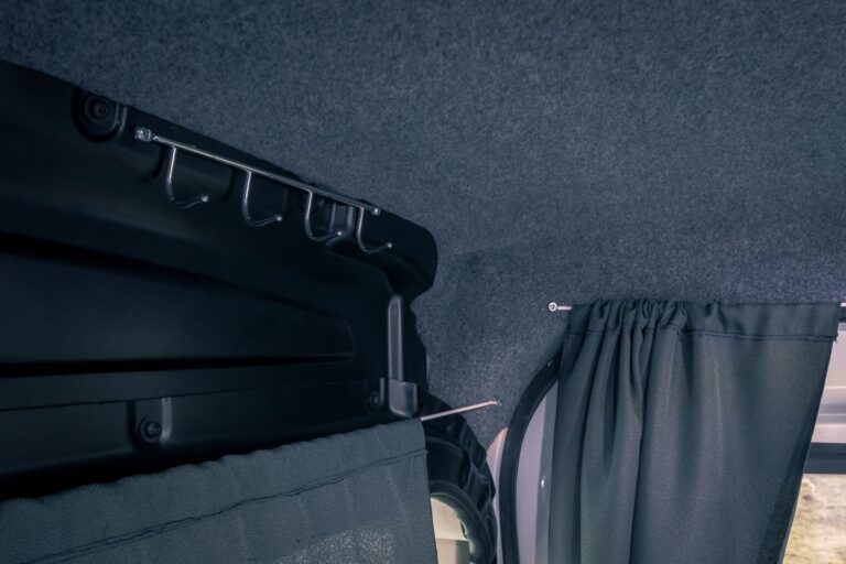 View on hangers and curtains inside a campervan