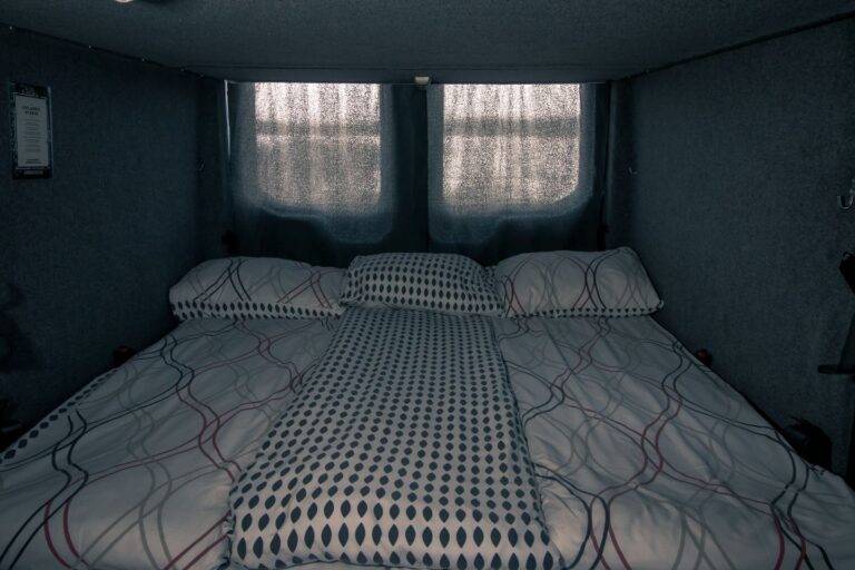 A set up bedding inside a campervan.