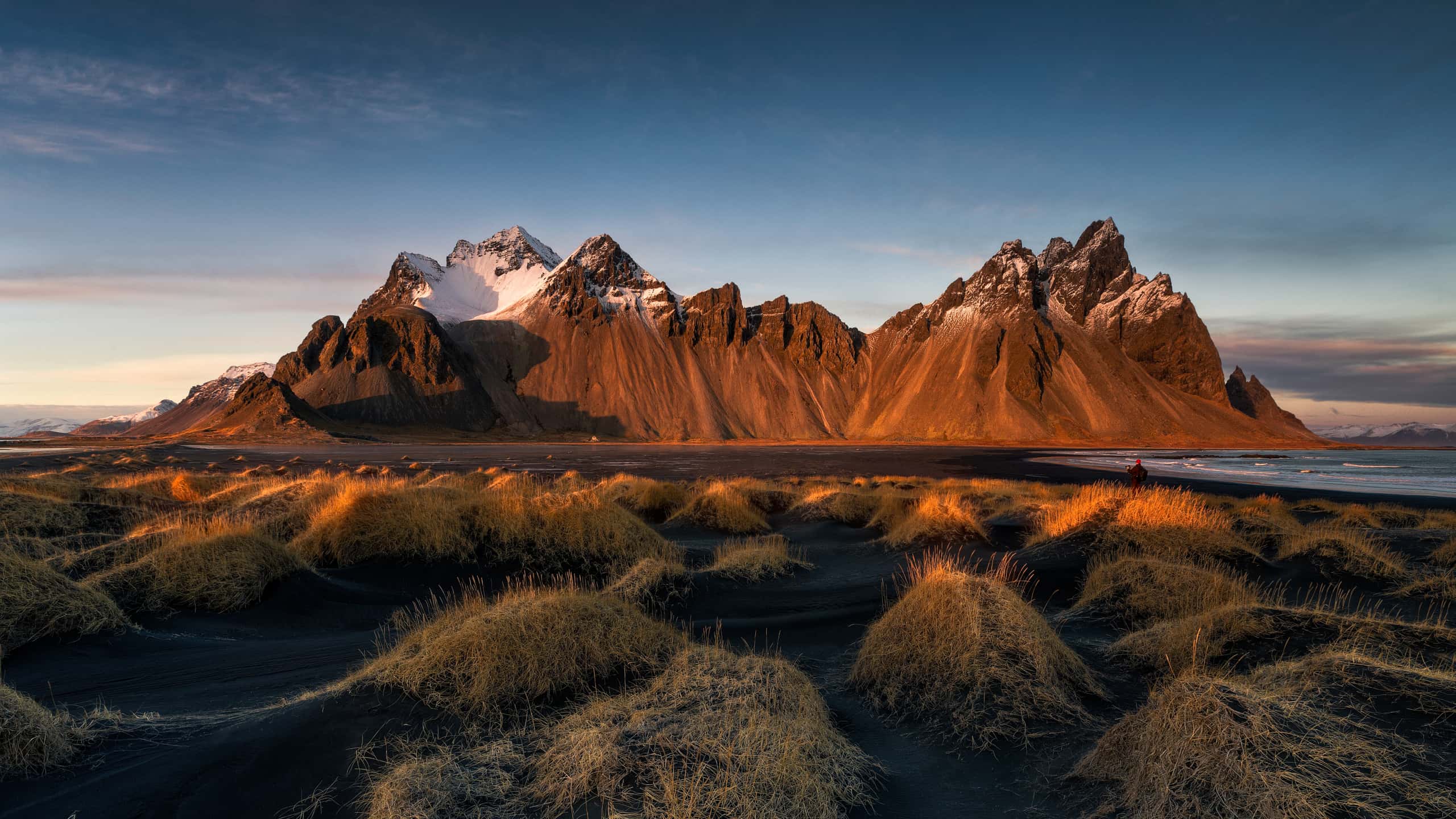 Scenic view of Vestrahorn mountain in Iceland at sunset, a popular road trip destination for campervan travelers.