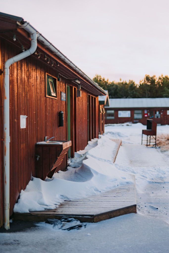 A building on a snow-covered campground.